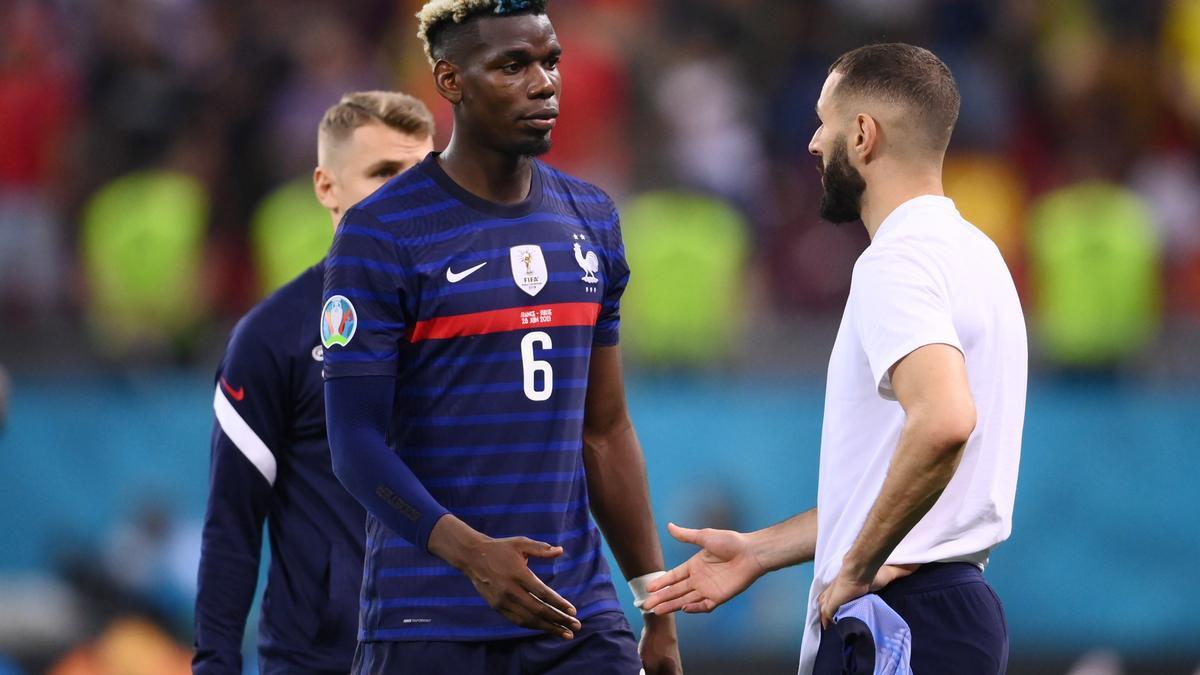 Pogba saluda a Benzema.