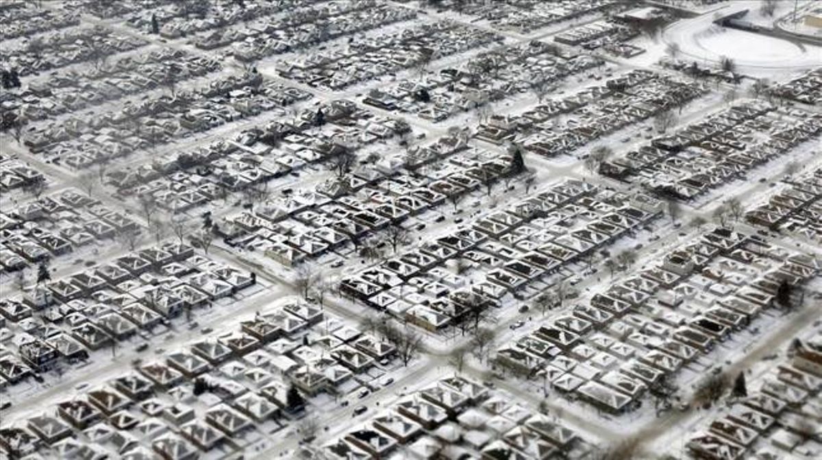 Cases cobertes de neu i gel a Chicago.