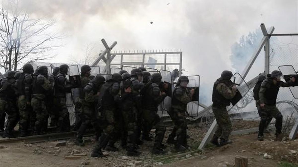 icoy32995667 stranded refugees and migrants break an iron fence160229155836