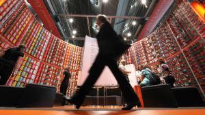 A woman walks by the booth of German publisher Droemer Knaur during the 62nd International Book Fair in Frankfurt am Main, on October 6, 2010. Publishers and authors at the world’s biggest book fair are battling to entice a new generation of readers with the latest multimedia products. The 62nd edition of the fair runs from October 6 to 10, 2010. AFP PHOTO / DANIEL ROLAND