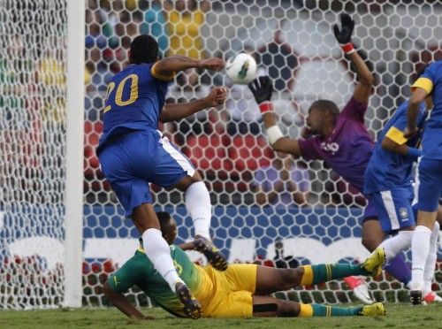 Brazil's Hulk scores a goal against South Africa's goalkeeper Khune during their international friendly soccer match in Sao Paulo