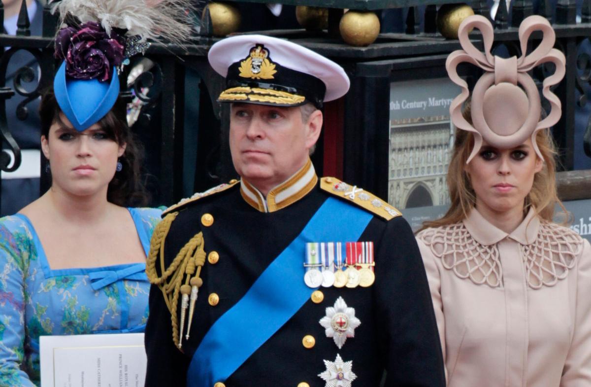 FILE - Britain's Prince Andrew, center, and his daughters Princess Eugenie, left, and Princess Beatrice leave Westminster Abbey after the wedding of Prince William to Catherine Middleton, in London, April 29, 2011. (AP Photo/Gero Breloer, File). FILE PHOTO
