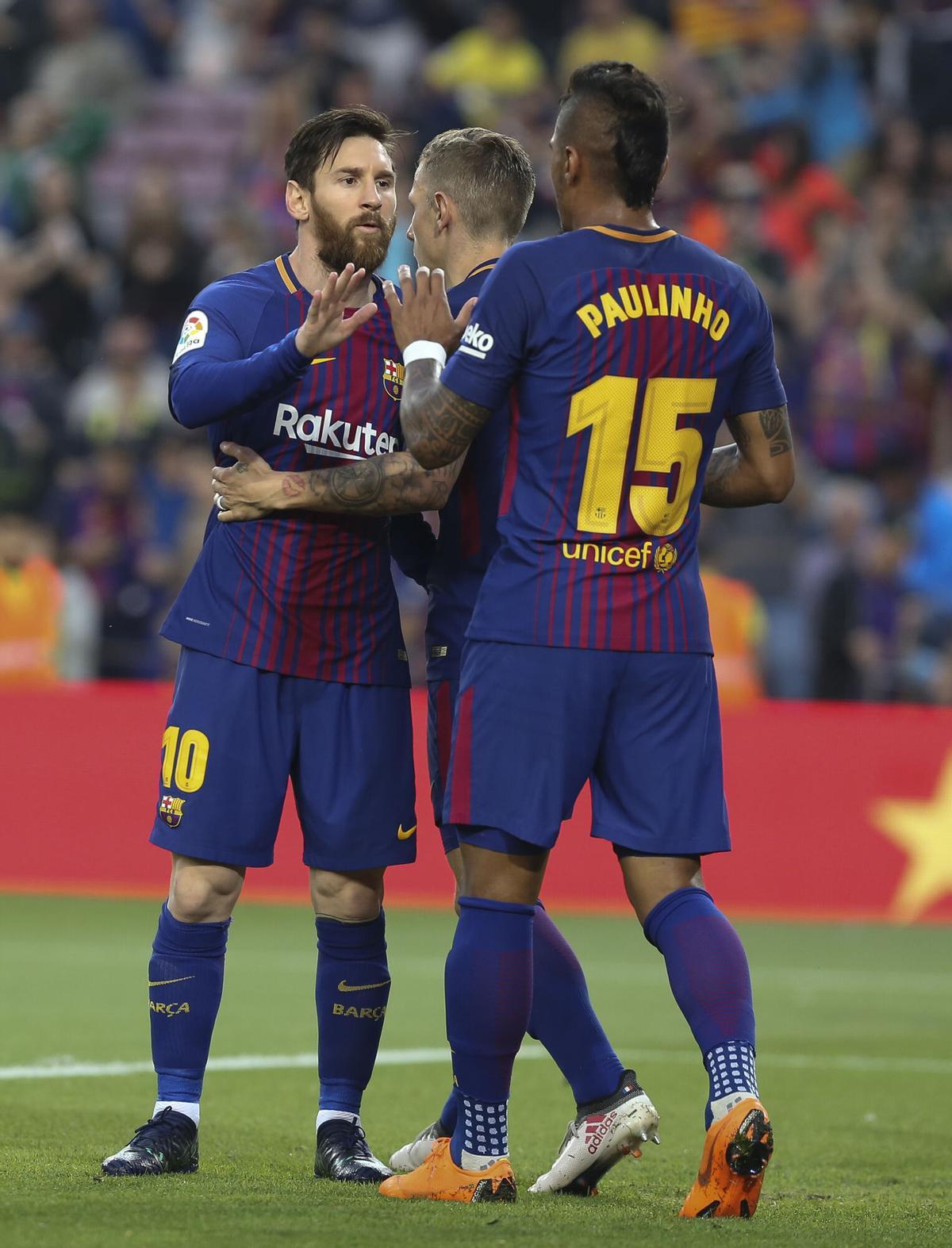 Paulinho celebra un gol con Messi en su etapa en el FC Barcelona