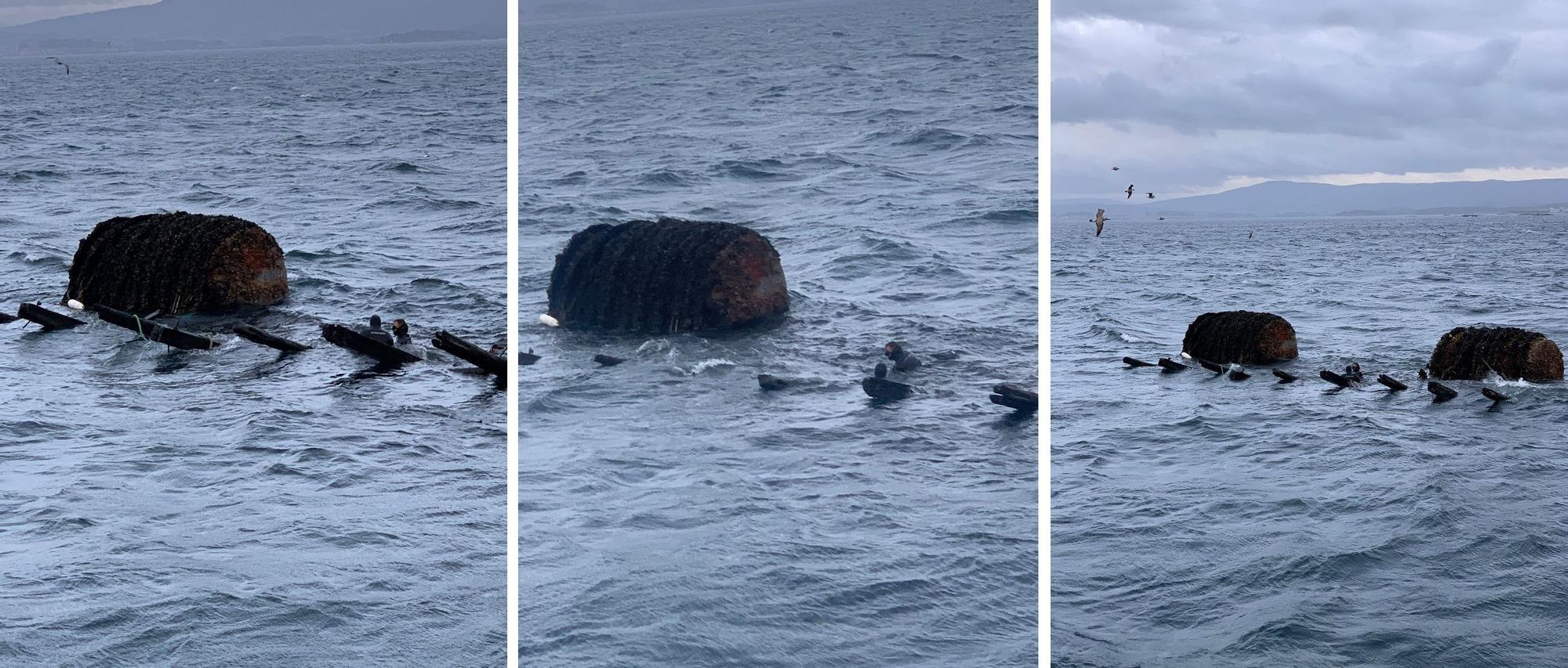 Submarinistas de Dragados Osmar asegurando un bidón de batea y parte de su emparrillado para poder remolcarlos a tierra firme.