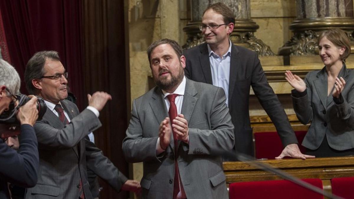 Mas, Junqueres y Herrera, en el pleno del Parlament que aprobó la declaración soberanista.