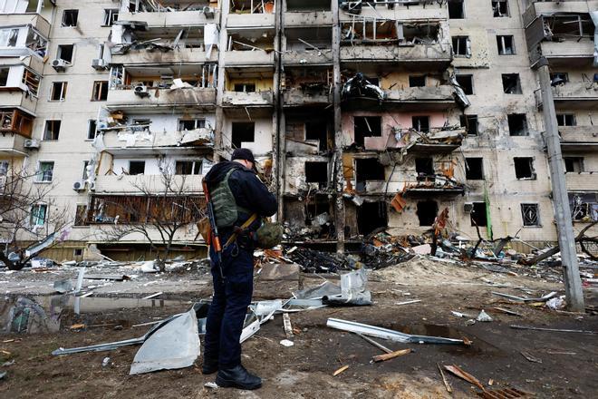 A residential building is damaged, after Russia launched a massive military operation against Ukraine, in Kyiv