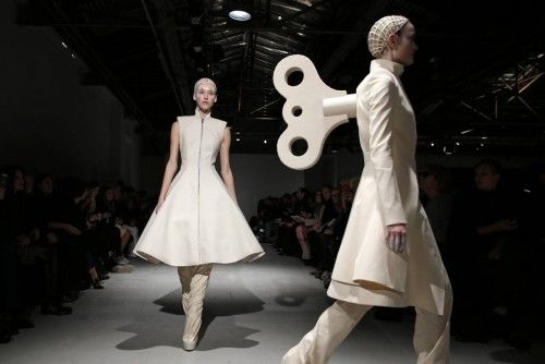 Models present creations by designer Gareth Pugh as part of his Fall/Winter 2014-2015 women's ready-to-wear collection show during Paris Fashion Week