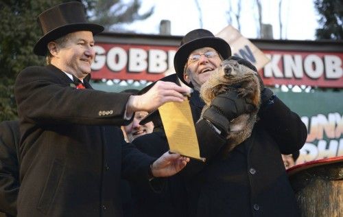 Groundhog Club Vice President Lundy shares Punxsutawney Phil's prediction with co-handler  Ploucha after Phil's annual weather prediction on Gobbler's Knob on the 130th Groundhog Day in Punxsutawney