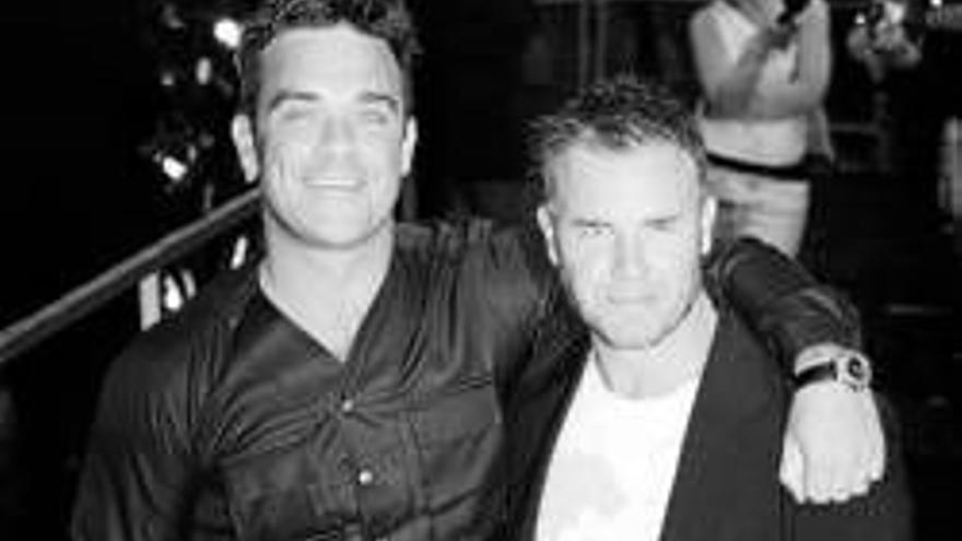 Robbie Williams: EL ARTISTA IRA DE GIRA CON TAKE THAT