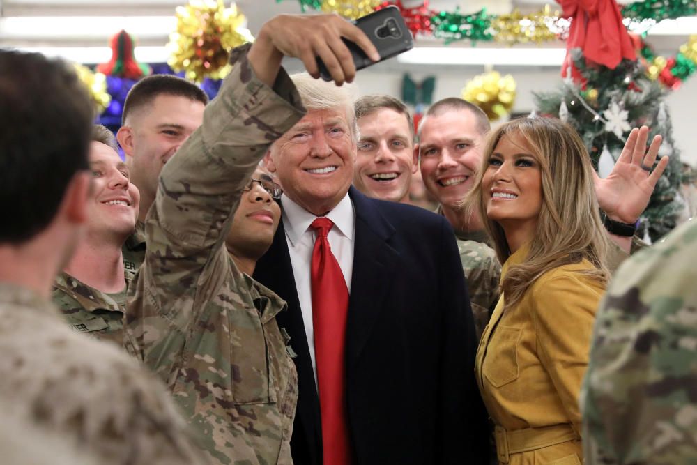 U.S. President Trump and the First Lady greet ...