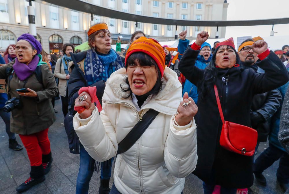 Women's rights activists shout during a ...