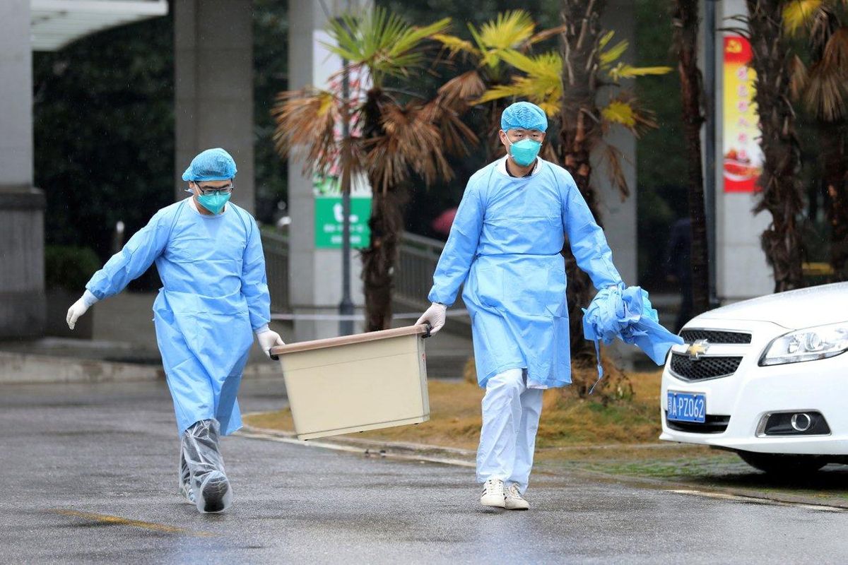 FILE PHOTO: Medical staff carry a box as they walk at the Jinyintan hospital, where the patients with pneumonia caused by the new strain of coronavirus are being treated, in Wuhan, Hubei province, China January 10, 2020. REUTERS/Stringer/File Photo FILE PHOTO: Medical staff carry a box as they walk at the Jinyintan hospital, where the patients with pneumonia caused by the new strain of coronavirus are being treated, in Wuhan, Hubei province, China January 10, 2020. REUTERS/Stringer/File Photo