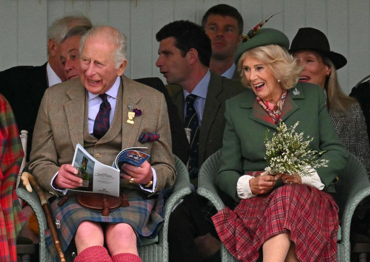 Britain's King Charles III and Britain's Queen Camilla react as they attend the annual Braemar Gathering in Braemar, central Scotland, on September 5, 2026. (Photo by ANDY BUCHANAN / AFP)