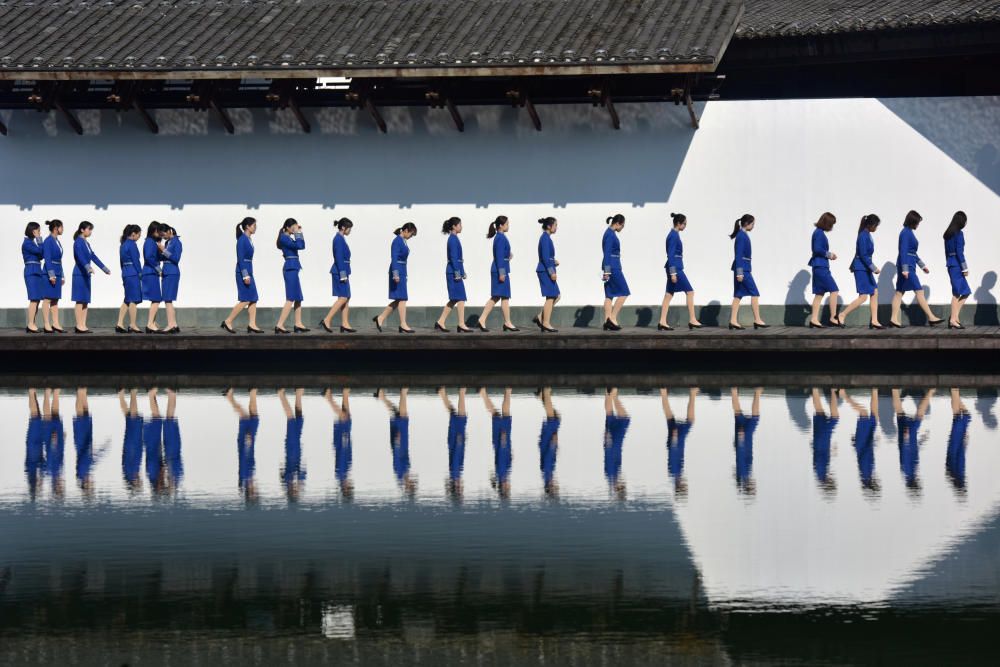 Attendants for the fifth WIC are seen reflected ...