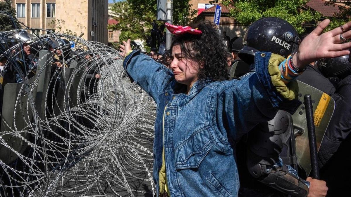zentauroepp42962221 an armenian opposition supporter gestures in front of barbed180416174346