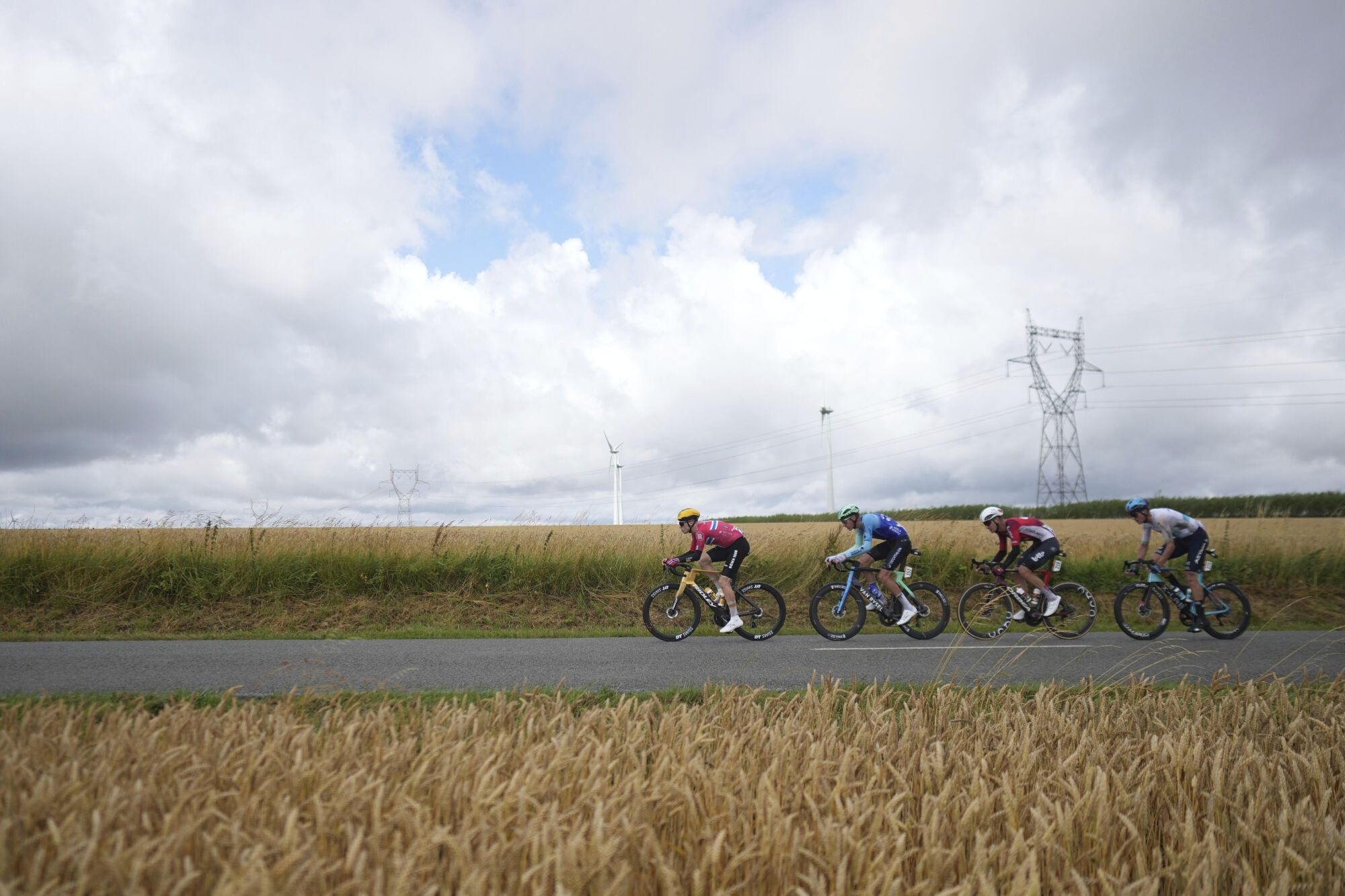 From left, Norway's Andreas Leknessund, France's Bruno Armirail, Belgium's Brent van Moer and Kazakhstan's Yevgeniy Fedorov ride during the second stage of the Tour de France cycling race over 209.1 kilometers (129.9 miles) with start in Lauwin-Planque and finish in Boulogne-sur-Mer, France, Sunday, July 6, 2025. (AP Photo/Thibault Camus). EDITORIAL USE ONLY/ONLY ITALY AND SPAIN