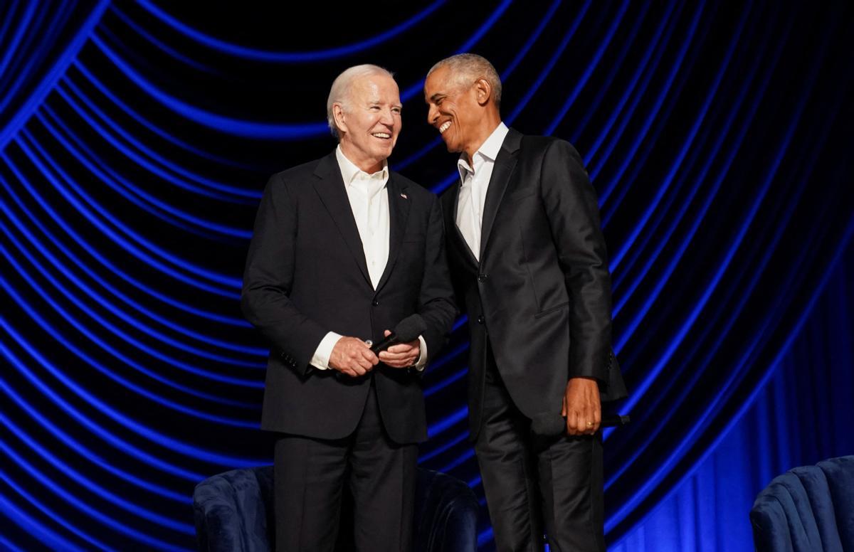 U.S. President Joe Biden and former U.S. President Barack Obama share a laugh during a star-studded campaign fundraiser at the Peacock Theater in Los Angeles, California, U.S., June 15, 2024. REUTERS/Kevin Lamarque