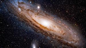 Esta imagen de la galaxia de Andrómeda, tomada con un pequeño telescopio, incluye dos galaxias enanas.