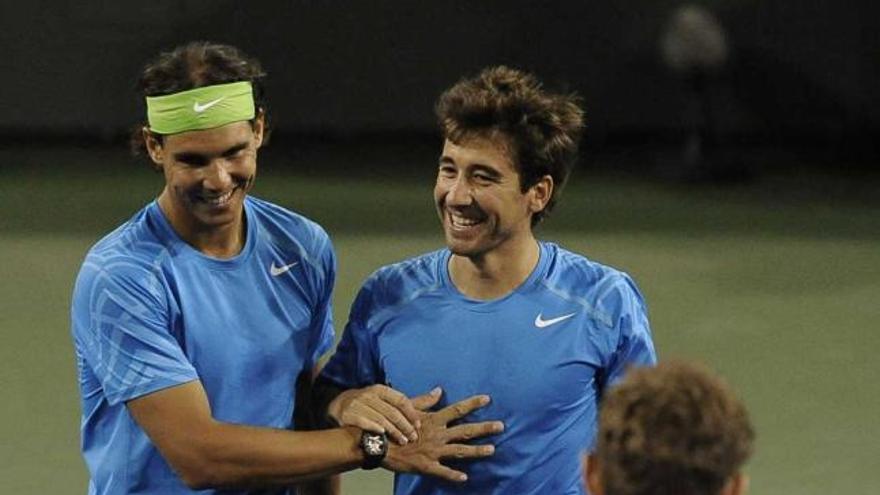 Nadal y López festejan una victoria en el torneo de dobles de Indian Wells.