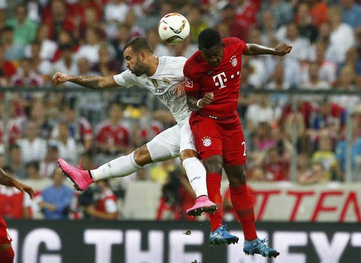 Bayern Munich's Alaba jumps for the ball with Real Madrid's Jese during their pre-season Audi Cup tournament final soccer match in Munich