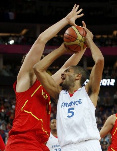 France's Batum is guarded by Spain's Gasol during their men's quarterfinal basketball match at the North Greenwich Arena in London during the London 2012 Olympic Games