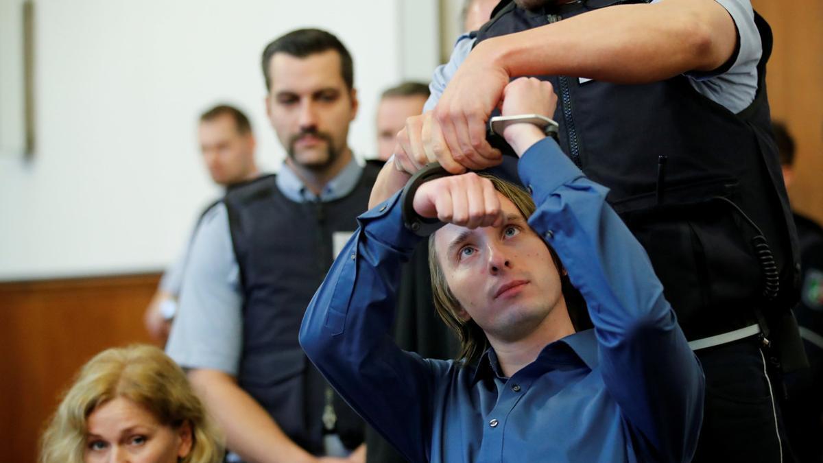 Sergej W., who is suspected of detonating three bombs, targeting the Borussia Dortmund soccer team bus in April, arrives to stand trial at a German state court in Dortmund