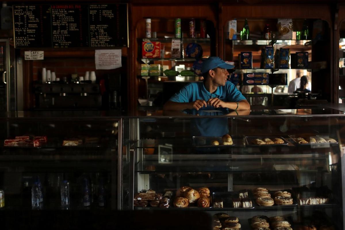 A worker stands inside a bakery during an ongoing blackout in Caracas  Venezuela March 10  2019  REUTERS Manaure Quintero NO RESALES  NO ARCHIVES