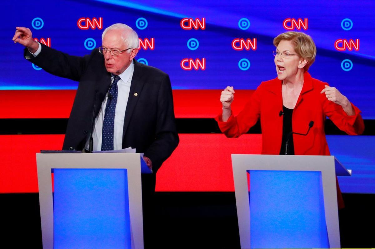 U S  Senator Bernie Sanders and U S  Senator Elizabeth Warren speak on the first night of the second 2020 Democratic U S  presidential debate in Detroit  Michigan  U S   July 30  2019  REUTERS Lucas Jackson     TPX IMAGES OF THE DAY