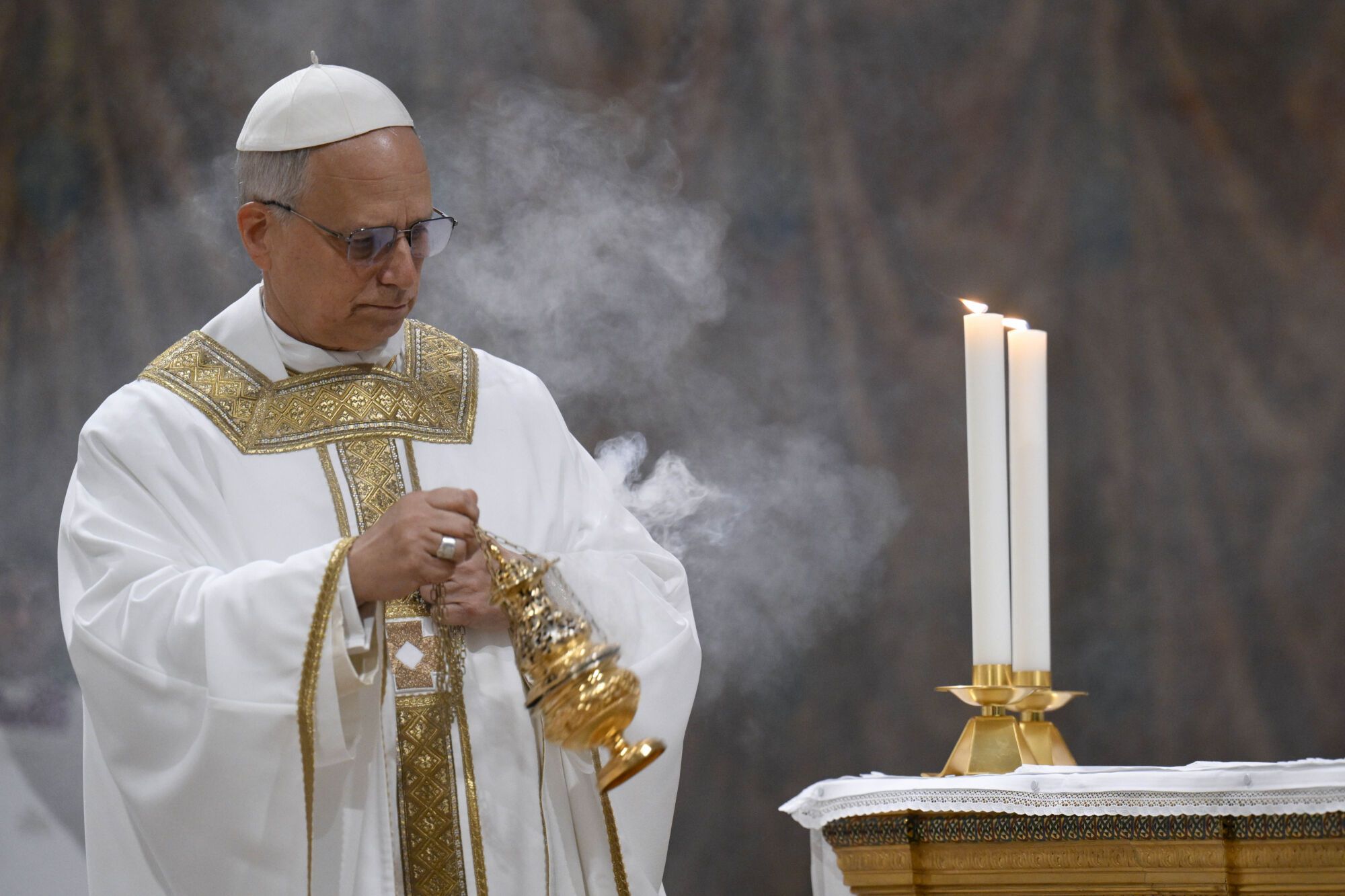 Newly elected Pope Leo XIV concelebrates Mass with the College of Cardinals inside the Sistine Chapel at the Vatican the day after his election as 267th pontiff of the Roman Catholic Church, Friday, May 9, 2025. (Vatican Media via AP). AP PROVIDES ACCESS TO THIS GOVERNMENT PRODUCED PHOTO SOLELY TO ILLUSTRATE NEWS REPORTING OR COMMENTARY ON FACTS DEPICTED IN IMAGE; MUST BE USED WITHIN 14 DAYS FROM TRANSMISSION; NO ARCHIVING; NO LICENSING; MANDATORY CREDIT