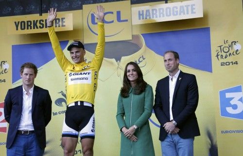 Prince Harry, Prince William, the Duke of Cambridge and his wife, Catherine, the Duchess of Cambridge pose with Giant-Shimano team rider Kittel of Germany on the podium of the first 190.5 km stage of  the Tour de France cycling race