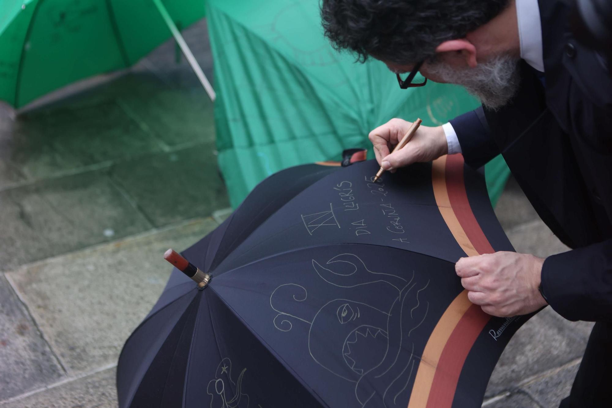 Pintada de paraguas en honor a Urbano Lugrís