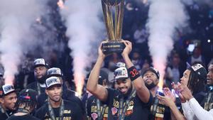 New York Knicks center Karl-Anthony Towns (32) celebrates with teammates after his teams victory against the San Antonio Spurs in the NBA Cup championship basketball game Tuesday, Dec. 16, 2025, in Las Vegas. (AP Photo/Ian Maule)