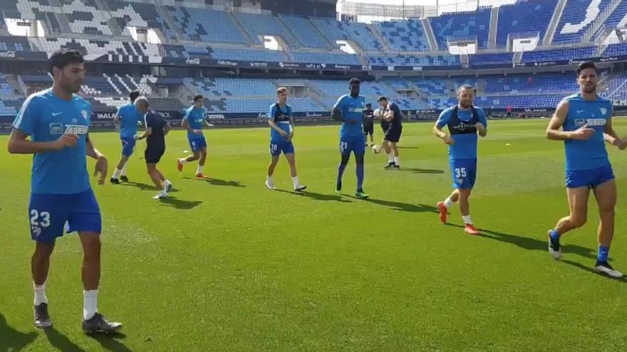 N&#039;Diaye, junto a otros futbolistas blanquiazules en el entrenamiento en La Rosaleda