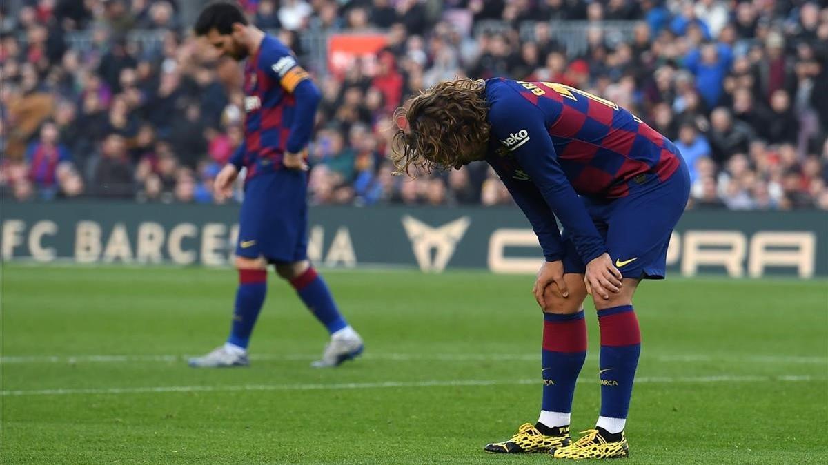 Griezman y Messi, tras perder una ocasión de gol ante el Getafe
