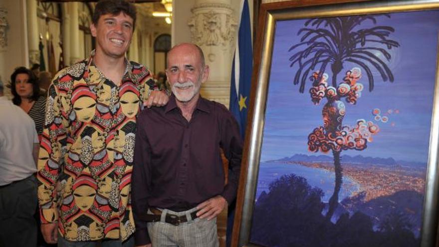 El pregonero de la feria, Javier Ojeda, junto al creador del cartel José Luis Bola.