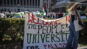 A sign is displayed  in front of the tents erected at the Pro-Palestine protest encampment at the Columbia University campus in New York on Monday April 22, 2024. (AP Photo/Stefan Jeremiah)