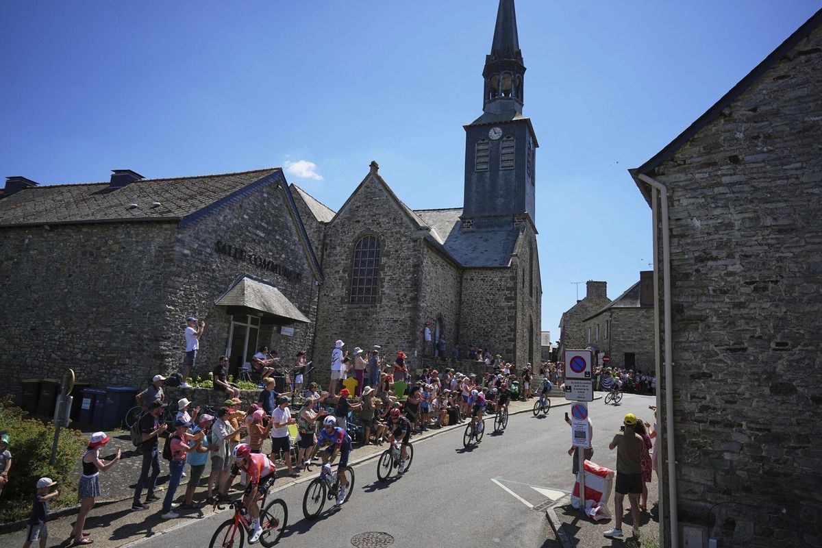 The pack rides during the eighth stage of the Tour de France cycling race over 171.4 kilometers (106.5 miles) with start in Saint-Meen-le-Grand and finish in Laval Espace Mayenne, France, Saturday, July 12, 2025. (AP Photo/Thibault Camus)