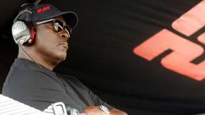 FILE - Michael Jordan, co-owner of 23XI Racing, sits in his pit box during a NASCAR Cup Series auto race at Talladega Superspeedway, Sunday, Oct. 6, 2024, in Talladega, Ala. (AP Photo/ Butch Dill, File). FILE