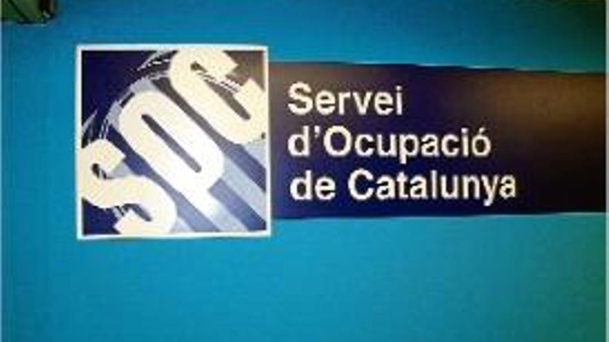 Cartell identificatiu del SOC en una Oficina de Treball de la Generalitat.