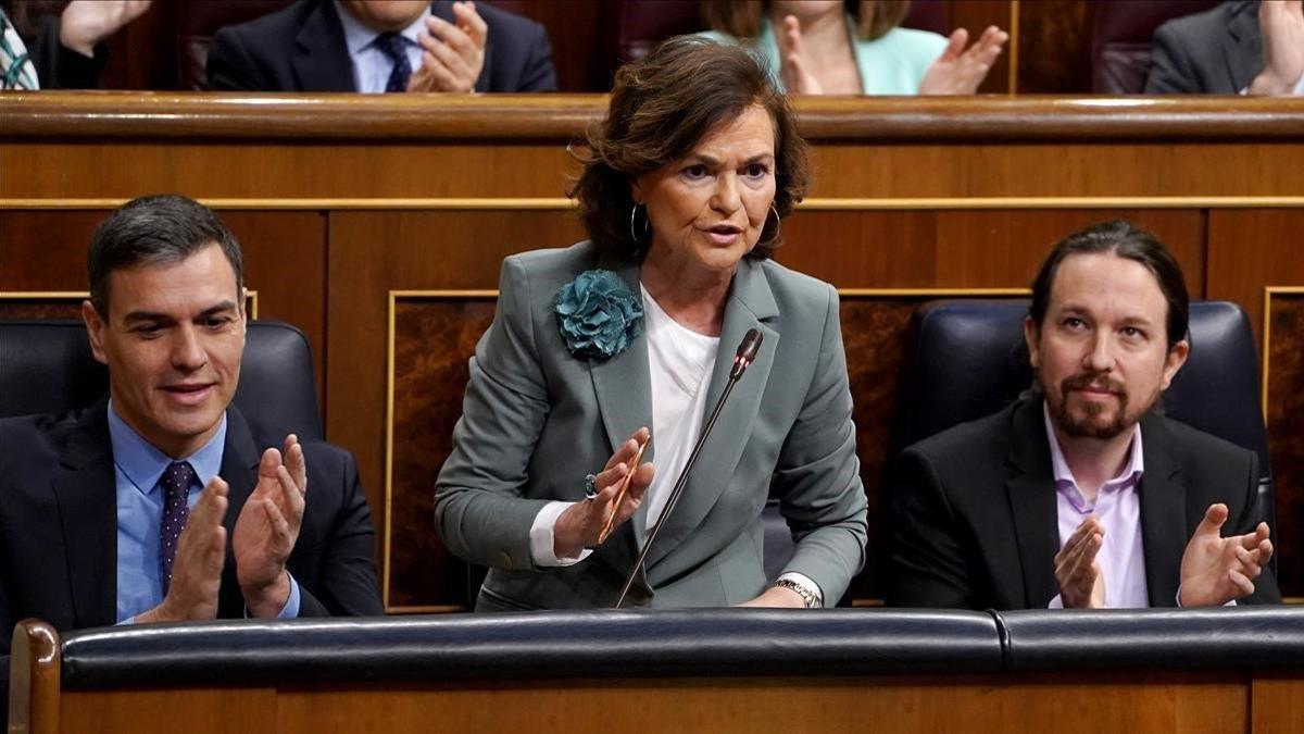 El presidente del Gobierno, Pedro Sánchez, la vicepresidenta Carmen Calvo y el vicepresidente Pablo Iglesias, en el Congreso.