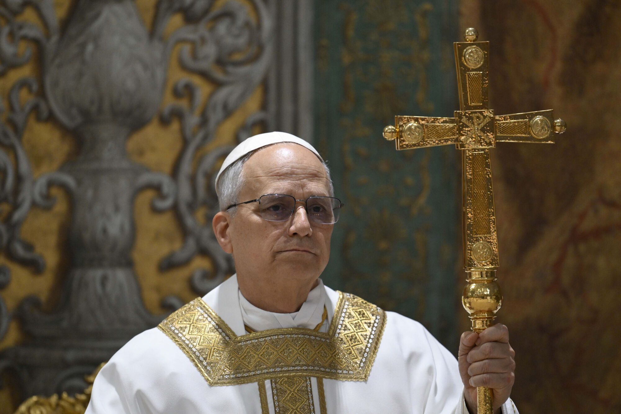 Newly elected Pope Leo XIV concelebrates Mass with the College of Cardinals inside the Sistine Chapel at the Vatican the day after his election as 267th pontiff of the Roman Catholic Church, Friday, May 9, 2025. (Vatican Media via AP). AP PROVIDES ACCESS TO THIS GOVERNMENT PRODUCED PHOTO SOLELY TO ILLUSTRATE NEWS REPORTING OR COMMENTARY ON FACTS DEPICTED IN IMAGE; MUST BE USED WITHIN 14 DAYS FROM TRANSMISSION; NO ARCHIVING; NO LICENSING; MANDATORY CREDIT