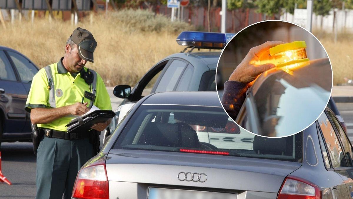 Un agente de la Guardia Civil da el alto a un conductor.