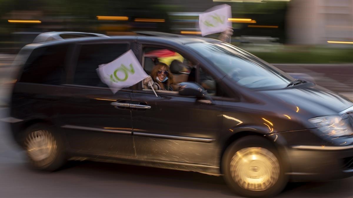 zentauroepp53482361 a woman waves a vox far right party flag during a protest ag200522151412