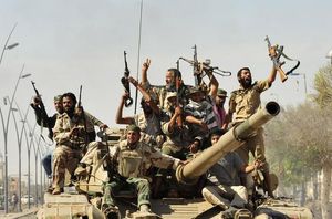 Combatents rebels celebren la caiguda del dictador libi, Muammar al-Gaddafi, a Sirte.