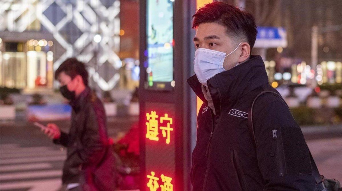 undefined52239115 february 10  2020  shanghai china   two men protective masks200210213617