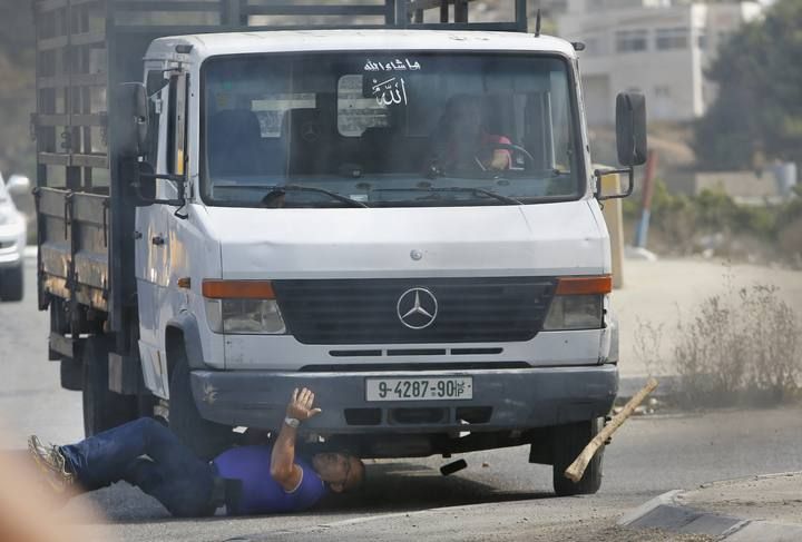 A Palestinian vehicle strikes an Israeli motorist, who died later, in the West Bank city of Hebron