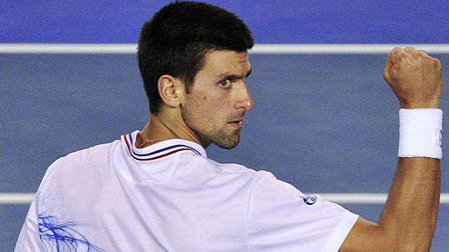 Djokovic celebra un tanto ante Murray.