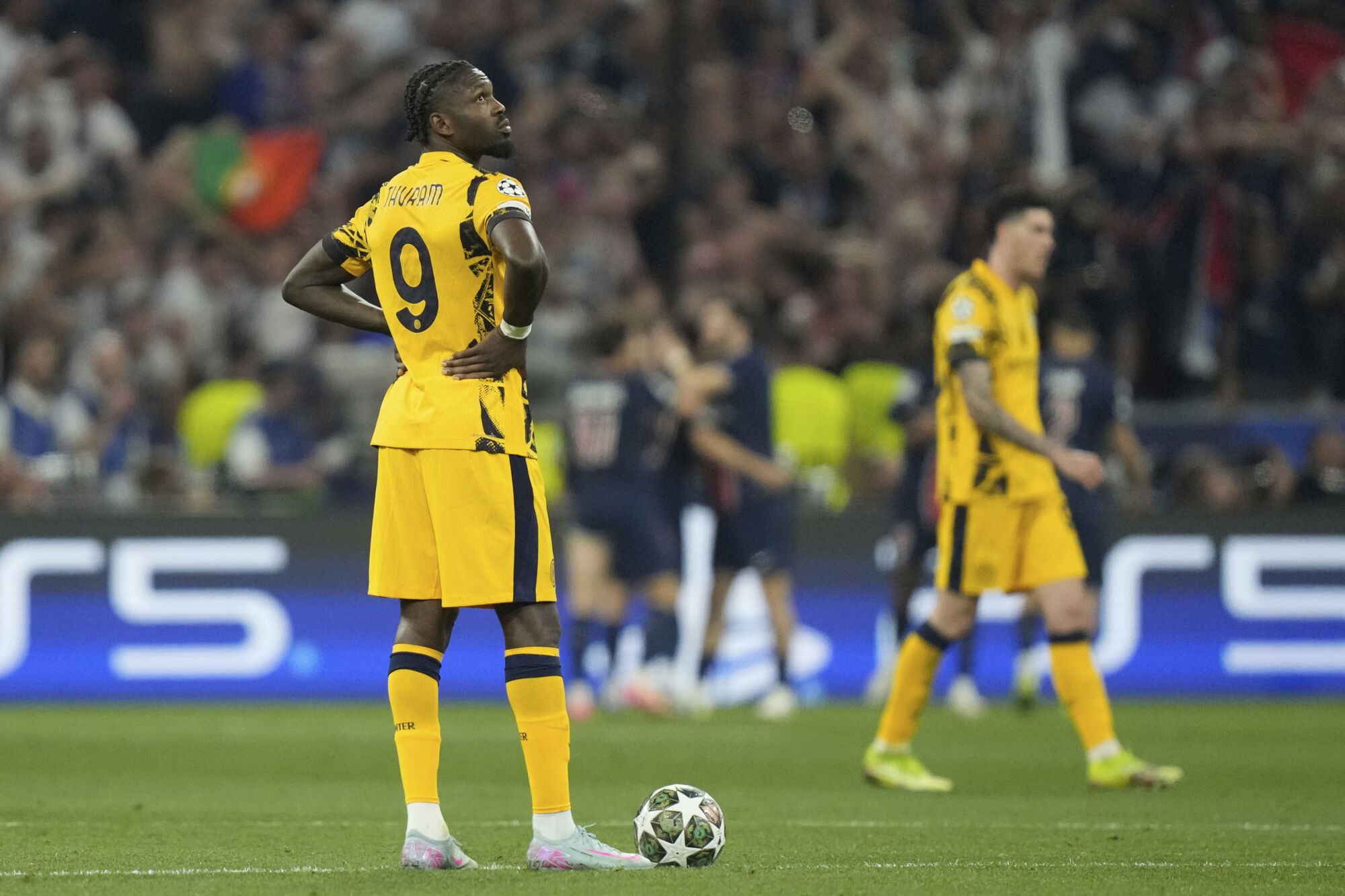Inter Milan's Marcus Thuram is dejected after PSG's Desire Doue scored his side's third goal during the Champions League final soccer match between Paris Saint-Germain and Inter Milan at the Allianz Arena in Munich, Germany, Saturday, May 31, 2025. (AP Photo/Matthias Schrader)