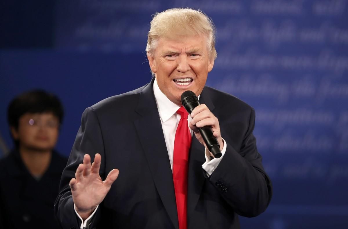 Republican U.S. presidential nominee Donald Trump speaks during the presidential town hall debate with Democratic U.S. presidential nominee Hillary Clinton (not pictured) at Washington University in St. Louis, Missouri, U.S., October 9, 2016.    REUTERS/Lucy Nicholson