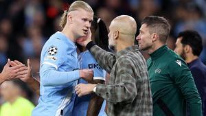 Haaland, junto a Guardiola, en el duelo contra el Madrid